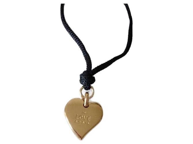 Yves Saint Laurent VINTAGE ▾ D'oro