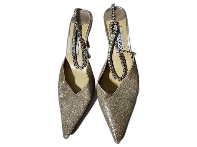 Tacchi in glitter polveroso Jimmy Choo Platinum Ice Saeda 100 con cinturino argentato con cristalli, taglia 37 Argento D'oro