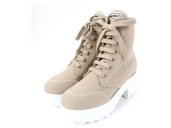 Stivali in tela con lacci e logo Miu Miu Beige