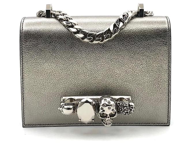 Mini borsa tirapugni di Alexander McQueen in pelle color oro antico D'oro Metallico